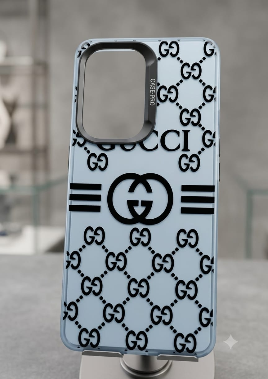 A light blue and black Gucci phone case with the classic GG monogram pattern, displayed on a stand against a blurred gray background.